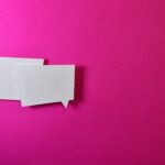 Two Message Balloons connote dialogue