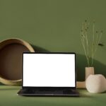 Laptop with blank screen placed on table